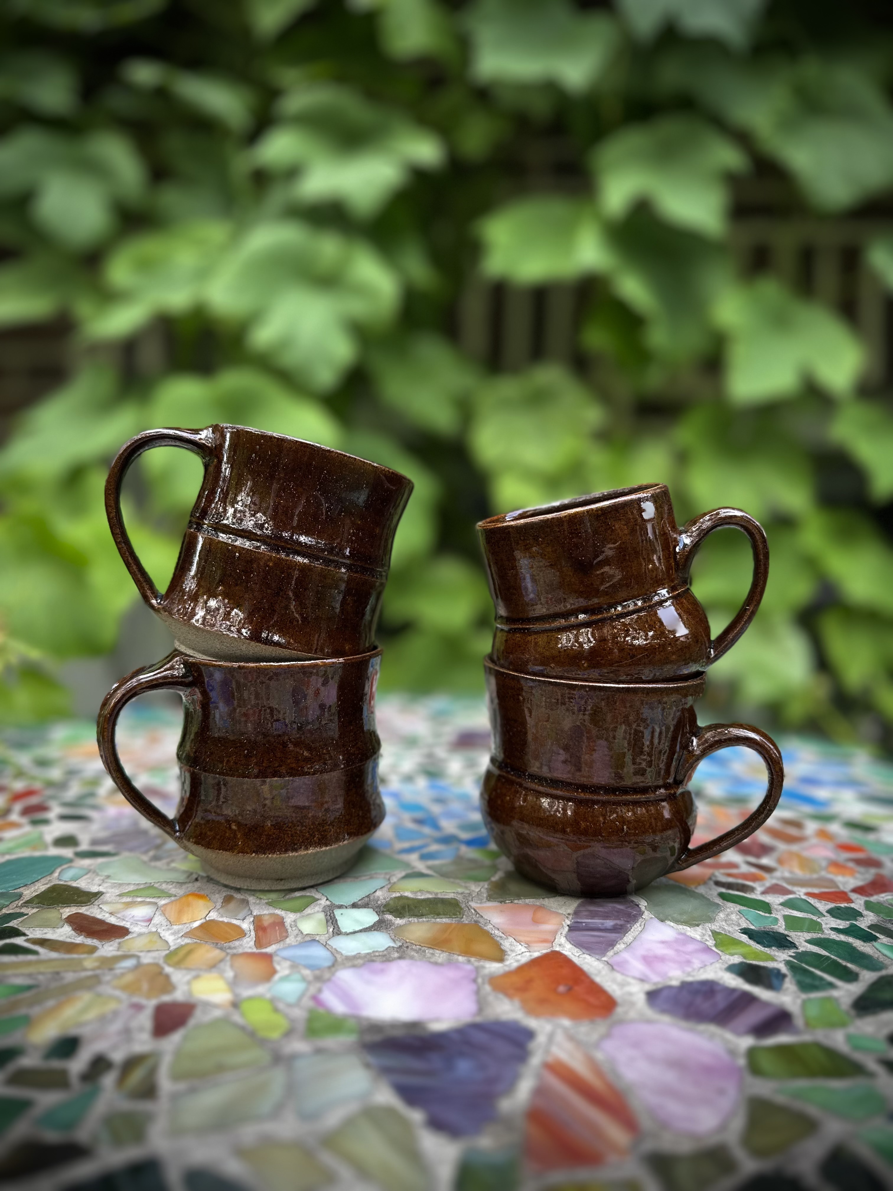 Handmade ceramic cups with natural glazes.