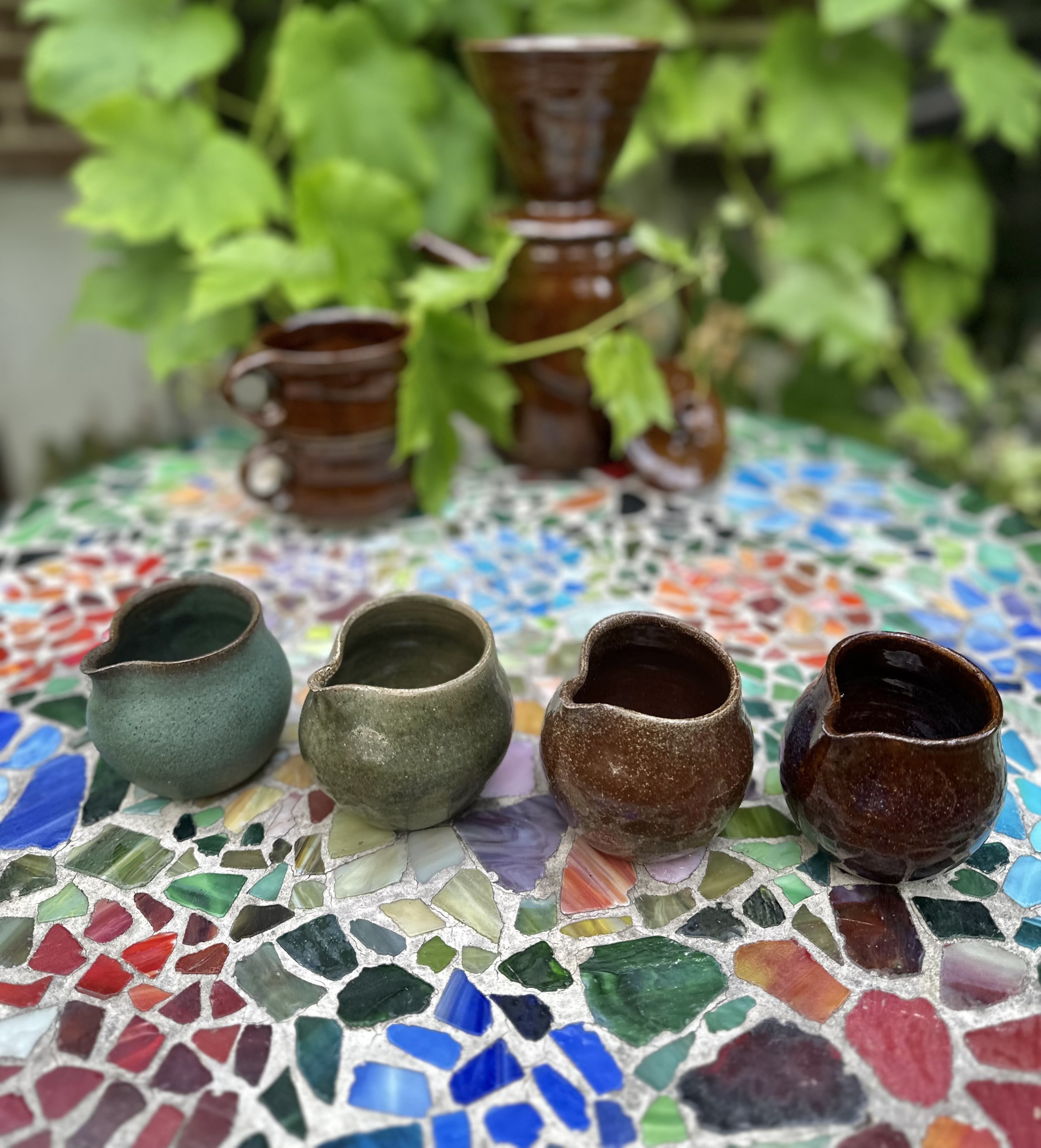 Handmade ceramic pitcher with natural glaze.